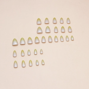 Gradient almond press-on nails in light yellow-green to milky white ombre effect