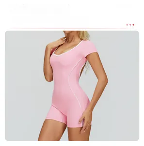 Detailed view of pink athletic bodysuit with white contrast piping and open back design