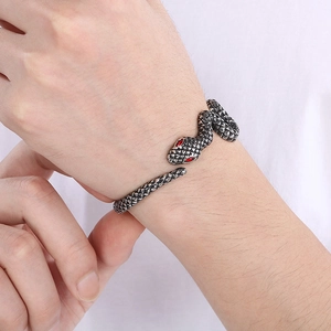 Vintage snake bangle for men in antique silver finish with red eyes on white background