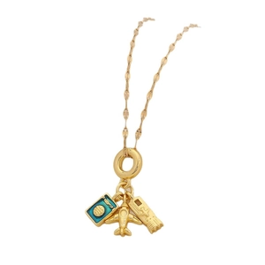 Gold-plated travel necklace with blue passport, airplane and camera charms on white background