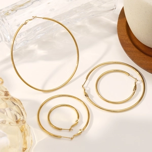Polished 18K gold plated stainless steel hoop earrings in various sizes for women
