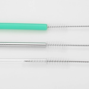 Detail showing versatile nylon straw cleaner brush inside glass, steel, and silicone tubes