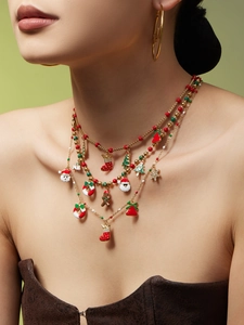 Collier doré multi-rangs avec breloques de Noël, Père Noël et sapin émaillés