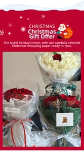 Detail of Christmas bouquets with red roses, pine cones and white snowflake cellophane wrap