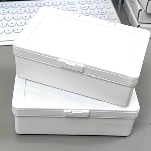 White stackable plastic storage box with flip-top lid and buckle for desktop organization