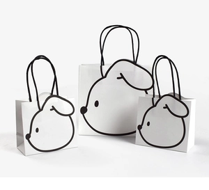 Three-piece cartoon dog print paper gift bags set in small medium and large sizes