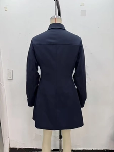 Back view of a navy blue long sleeve short dress with a structured lapel and fitted waist