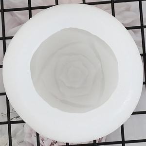 Top view of a white silicone rose flower mold for DIY candles and ice cubes