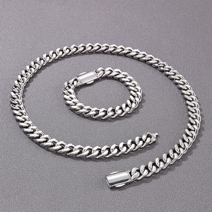 Detailed view of silver Cuban link necklace and bracelet set with box clasp