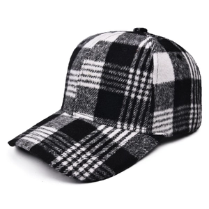 Detailed view of black and white plaid wool baseball cap with thick flannel texture