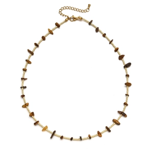 Detail of beaded necklace with irregular brown stones and gold adjustable lobster clasp