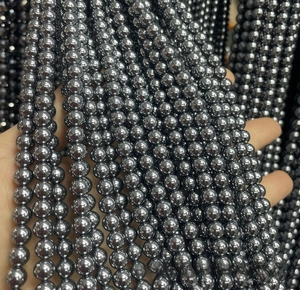 Macro shot of polished terahertz energy beads with high-gloss metallic finish