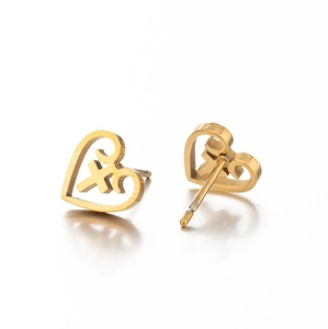 Detail of gold hollow heart stud earrings showing polished finish and pin structure