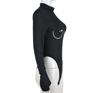 Detail of black long sleeve bodysuit with white line print and thumbhole cuffs