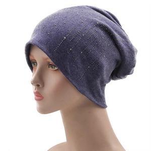 Detailed view of purple-grey cotton knit beanie with vertical rhinestone and bead accents