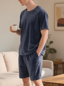 Close-up of men's navy blue velvet leisure set showing soft texture in a home setting