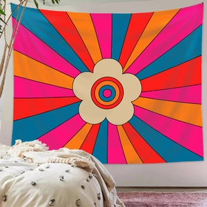 Detailed view of bohemian rainbow tapestry with psychedelic floral design on a wall