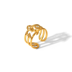 Detailed view of triple-layered golden ring with hand of Fatima and star accents