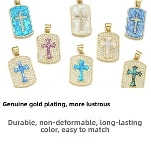 Detailed close-up of multi-color gold-plated cross pendants with inlaid zircon stones