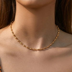 Minimalist 18K gold-plated bead necklace on model for a classic and elegant look