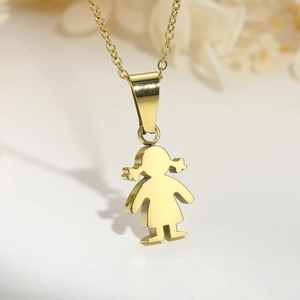 Macro shot of gold stainless steel necklace featuring a minimalist girl character pendant
