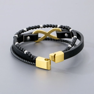 Detail of multi-layer black braided leather bracelet with golden infinity charm and beads