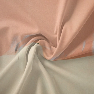 Detail of soft pink and beige bohemian tapestry fabric showing plush texture and drape