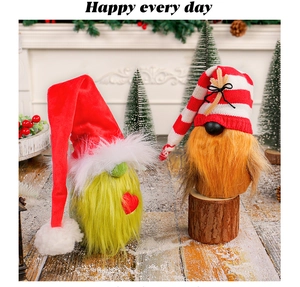 Detail of Christmas gnomes with green beard and red heart hats on a snowy wooden floor