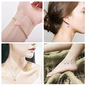 Set of gold and silver jewelry featuring translucent heart and square resin pendants
