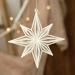 Macro detail of white glitter star ornament with silver string for Christmas tree decor