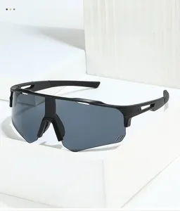 Detail of matte black cycling sunglasses with grey large one-piece lens and anti-slip temples