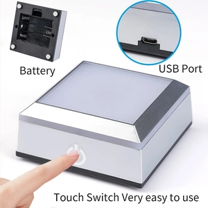 Square LED light base showing battery compartment, USB port, and touch sensitive switch
