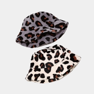 Detailed view of grey and beige leopard print faux fur bucket hats for winter
