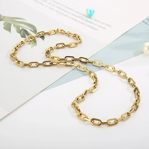 Detailed view of high-polish gold interlocking oval link stainless steel chain necklace