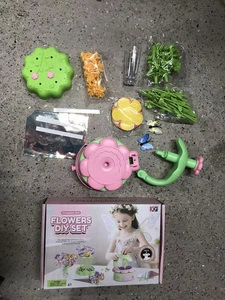 Detail view of the flowers DIY set including colorful petals, stems and press tool