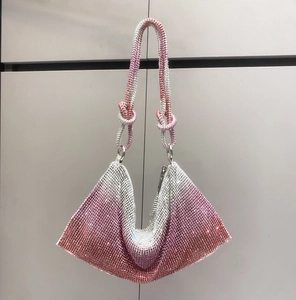 Detail of pink and silver gradient rhinestone hobo bag with knotted crystal handle