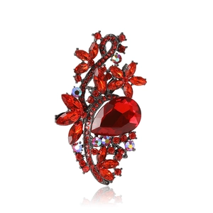 Vintage style alloy brooch with red crystals and teardrop gemstone on dark metal base