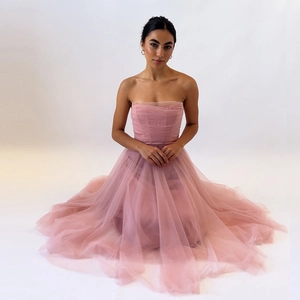 Pink sleeveless mesh corset dress with voluminous A-line tulle skirt for evening parties