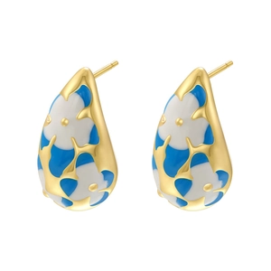 Detail of water drop earrings featuring blue and white enamel floral patterns on gold plating
