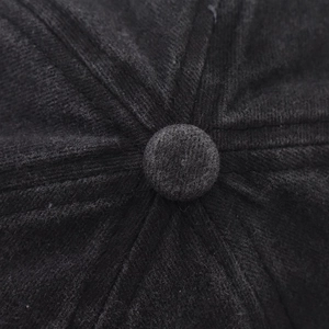 Close-up of the crown button and stitching on this washed gray vintage baseball cap