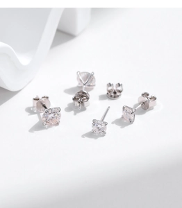 Detailed close-up of S925 sterling silver stud earrings with 1 carat moissanite diamonds