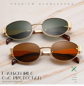 Detail of oval metal sunglasses showing gold alloy frames and anti-blue light lenses
