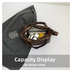 Top view of spacious interior of brown quilted tote bag showing large storage capacity