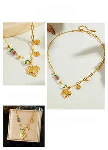 Detail of gold lava heart pendant with zircons and colorful gemstone beaded chain
