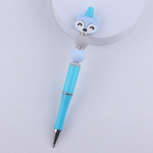 Detailed view of creative blue unicorn and fox silicone beaded pen with rhinestone accents