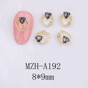 Macro shot of 3D hollow heart nail charms with gray rhinestones in 8x9mm size