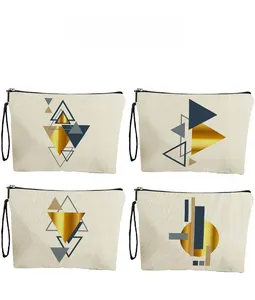Detail view of four canvas makeup bags with diverse geometric patterns and black zippers