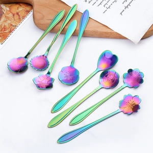 8-piece set of rainbow stainless steel flower-shaped coffee spoons on marble background