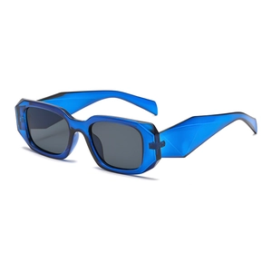 Modern geometric sunglasses with blue frames and dark lenses shown from a 45-degree angle