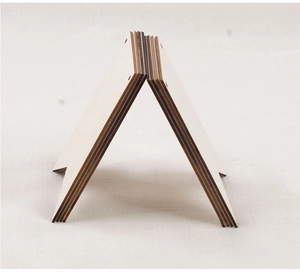 Macro side view of layered blank wooden craft signs with natural grain and smooth edges